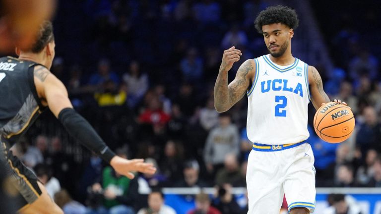 Mar 20, 2026; Philadelphia, PA, USA; UCLA Bruins guard Donovan Dent (2) dribbles the ball against the UCF Knights in the first half during a first round game of the men's 2026 NCAA Tournament at Xfinity Mobile Arena