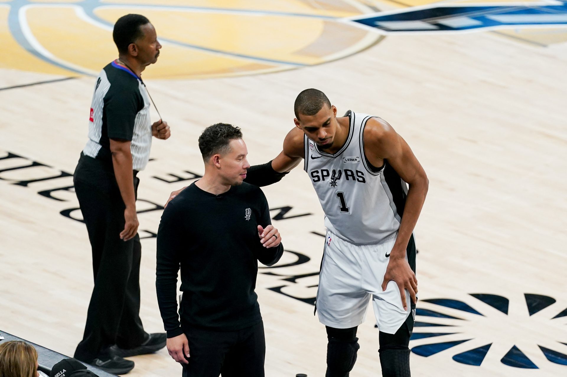 Jun 13, 2026; San Antonio, Texas, USA; San Antonio Spurs head coach Mitch Johnson talks with San Antonio Spurs forward Victor Wembanyama (1) against the New York Knicks in the second half during game five of the 2026 NBA Finals at Frost Bank Center.