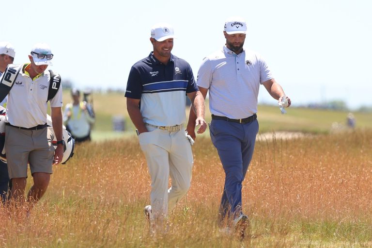 Jun 17, 2026; Southampton, New York, USA; Bryson DeChambeau (L) and Jon Rahm (R) walk together during a practice round for the U.S. Open golf tournament.