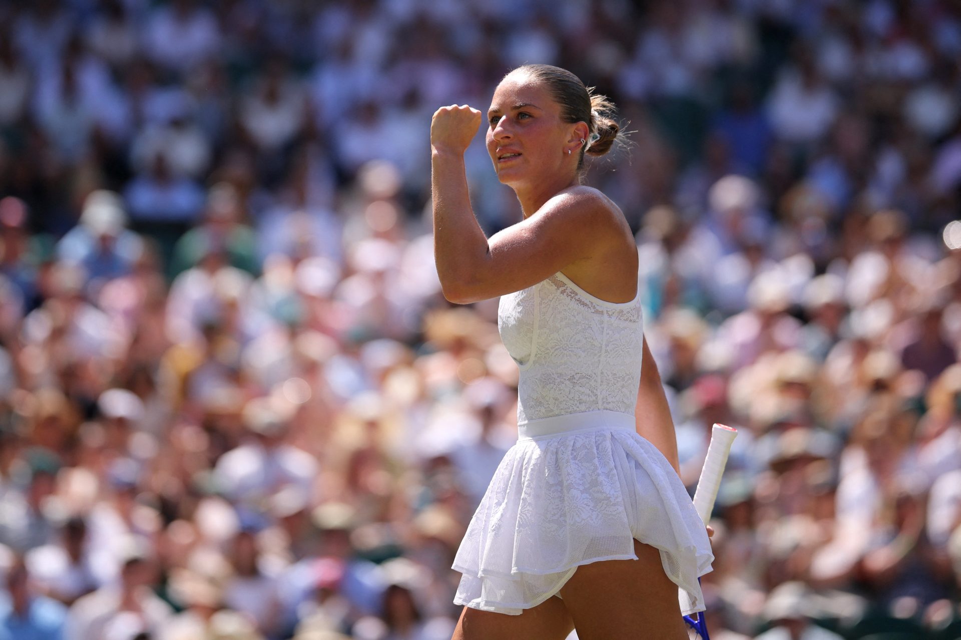 Tennis - Wimbledon - All England Lawn Tennis and Croquet Club, London, Britain - July 8, 2026 Ukraine's Marta Kostyuk reacts during her quarter final match against Italy's Jasmine Paolini