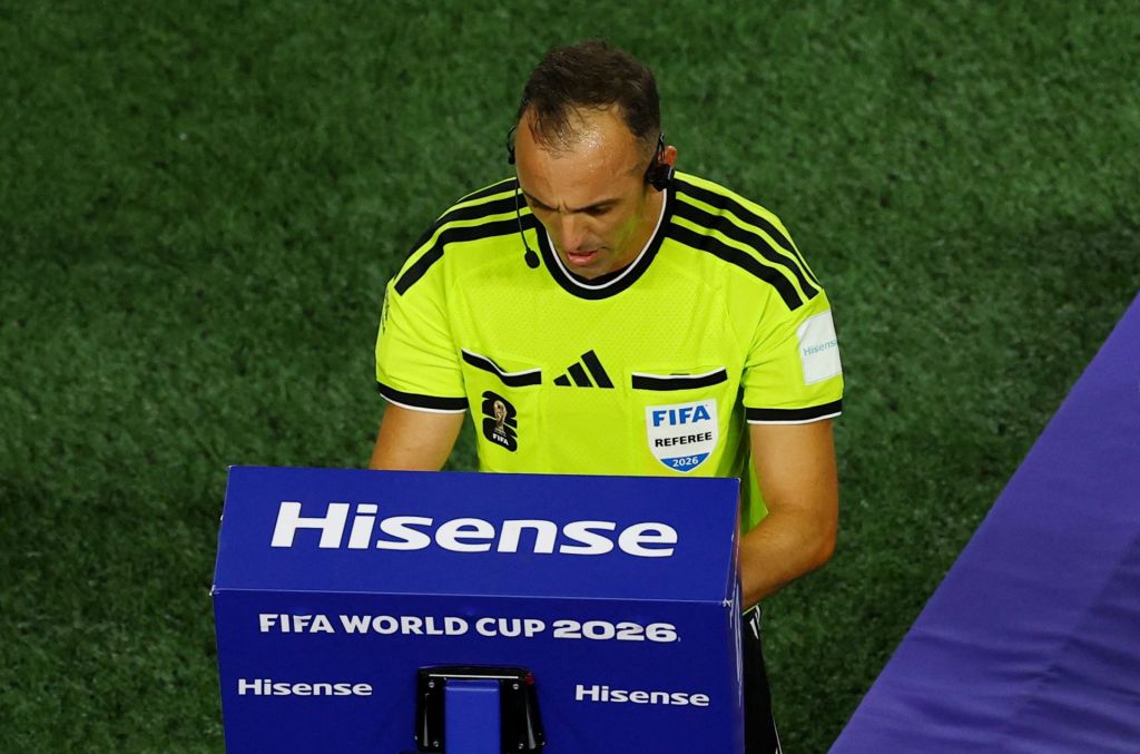 Soccer Football - FIFA World Cup 2026 - Quarter Final - Argentina v Switzerland - Kansas City Stadium, Kansas City, Missouri, U.S. - July 11, 2026 Referee Joao Pinheiro refers to VAR