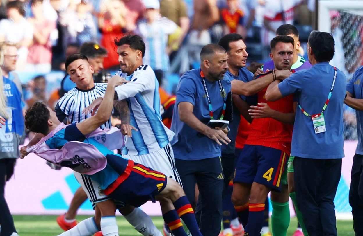 Soccer Football - FIFA World Cup 2026 - Final - Spain v Argentina - New York/New Jersey Stadium, East Rutherford, New Jersey, U.S. - July 19, 2026 Spain's Eric Garcia and Gavi clash with Argentina coach Lionel Scaloni, Thiago Almada and Leandro Paredes after the match