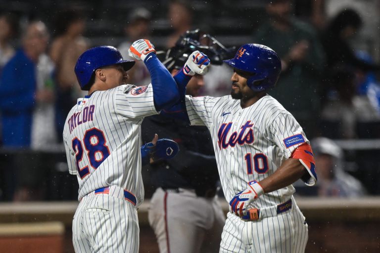 Jul 27, 2026; New York City, New York, USA; New York Mets second baseman Marcus Semien (10) is greeted at home plate by center fielder Tyrone Taylor (28) after hitting a two run home run against the Atlanta Braves during the sixth inning at Citi Field.