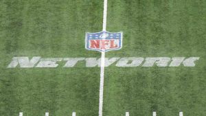 Mar 4, 2023; Indianapolis, IN, USA; The NFL Network logo on the field at Lucas Oil Stadium. Mandatory Credit: Kirby Lee-USA TODAY Sports