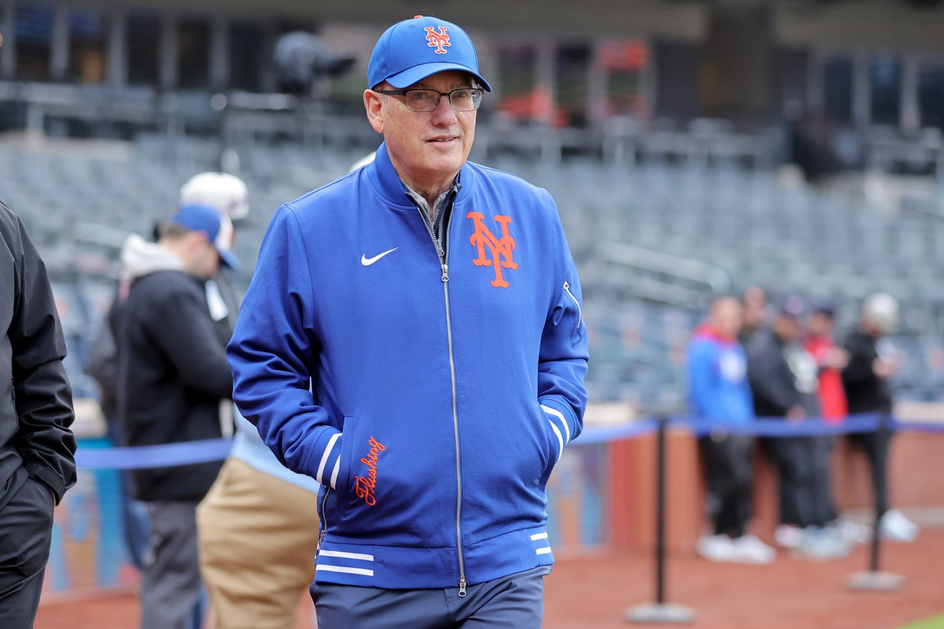 Apr 22, 2026; New York City, New York, USA; New York Mets owner Steve Cohen walks across the field during batting practice before a game against the Minnesota Twins at Citi Field.