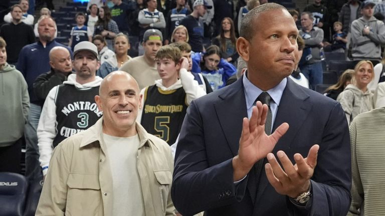 Mar 28, 2025; Minneapolis, Minnesota, USA; Minnesota Timberwolves minority owners Marc Lore and Alex Rodriguez celebrate the team's win over the Phoenix Suns at Target Center