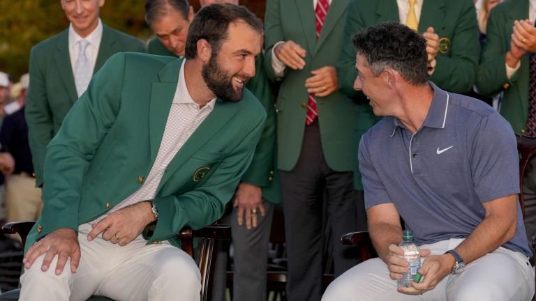 Apr 13, 2025; Augusta, Georgia, USA; Scottie Scheffler leans over to talk with Rory McIlroy at the green jacket ceremony during the final round of the Masters Tournament at Augusta National Golf Club. Mandatory Credit: Kyle Terada-Imagn Images
