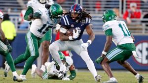 Dec 20, 2025; Oxford, MS, USA; Mississippi Rebels tight end Dae'Quan Wright (8) runs after a catch as Tulane Green Wave linebacker Sam Howard (15) makes the tackle during the third quarter at Vaught-Hemingway Stadium