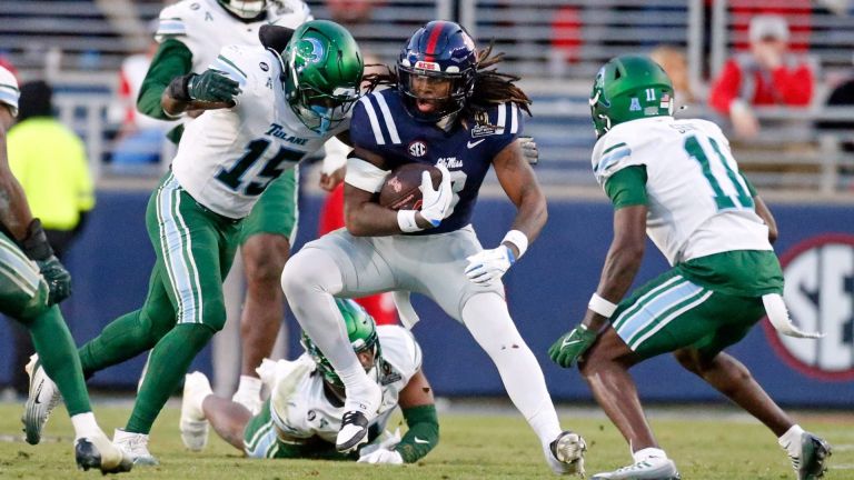 Dec 20, 2025; Oxford, MS, USA; Mississippi Rebels tight end Dae'Quan Wright (8) runs after a catch as Tulane Green Wave linebacker Sam Howard (15) makes the tackle during the third quarter at Vaught-Hemingway Stadium