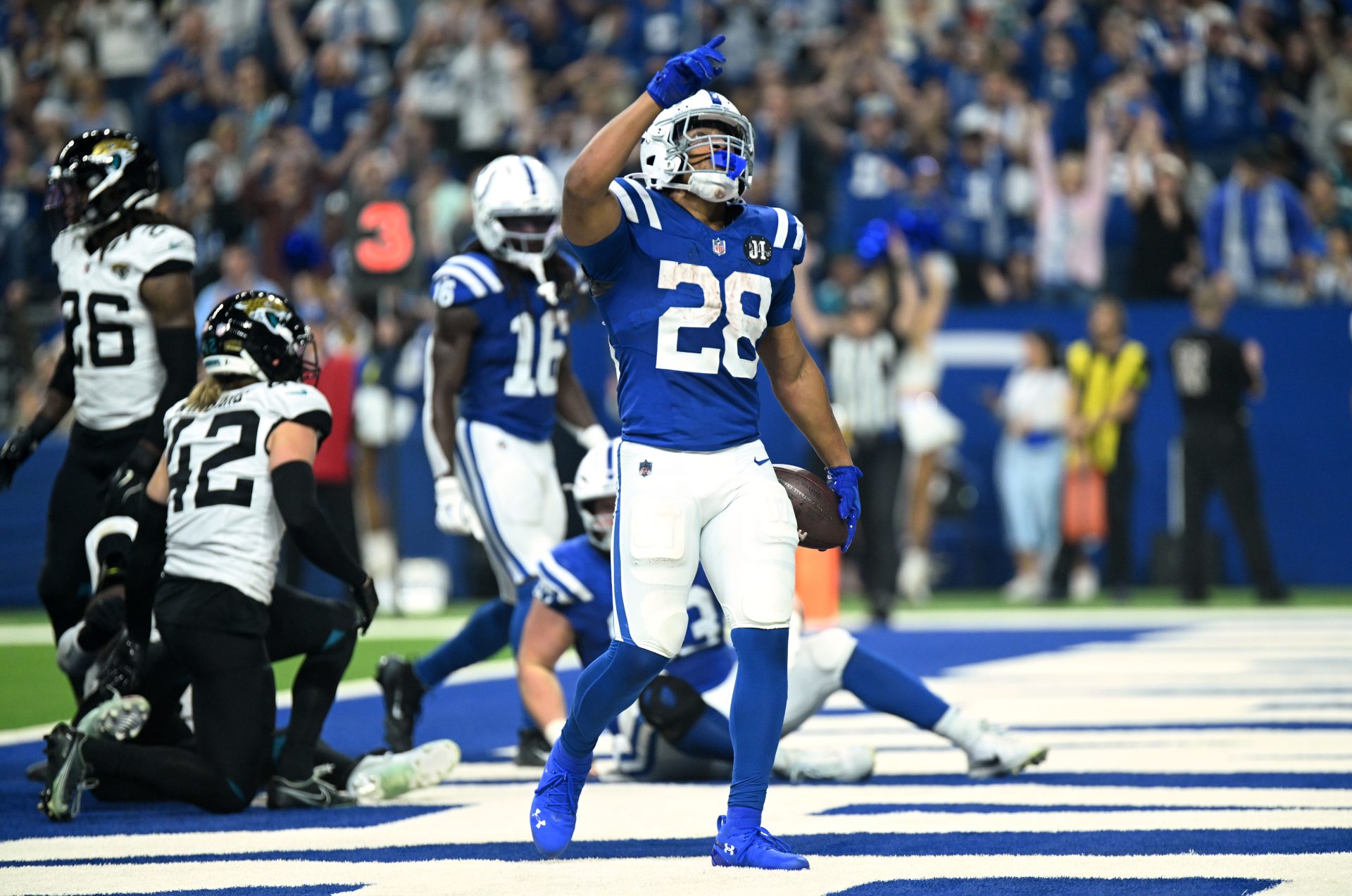 Dec 28, 2025; Indianapolis, Indiana, USA; Indianapolis Colts running back Jonathan Taylor (28) reacts after a touchdown during the first half against the Jacksonville Jaguars at Lucas Oil Stadium.