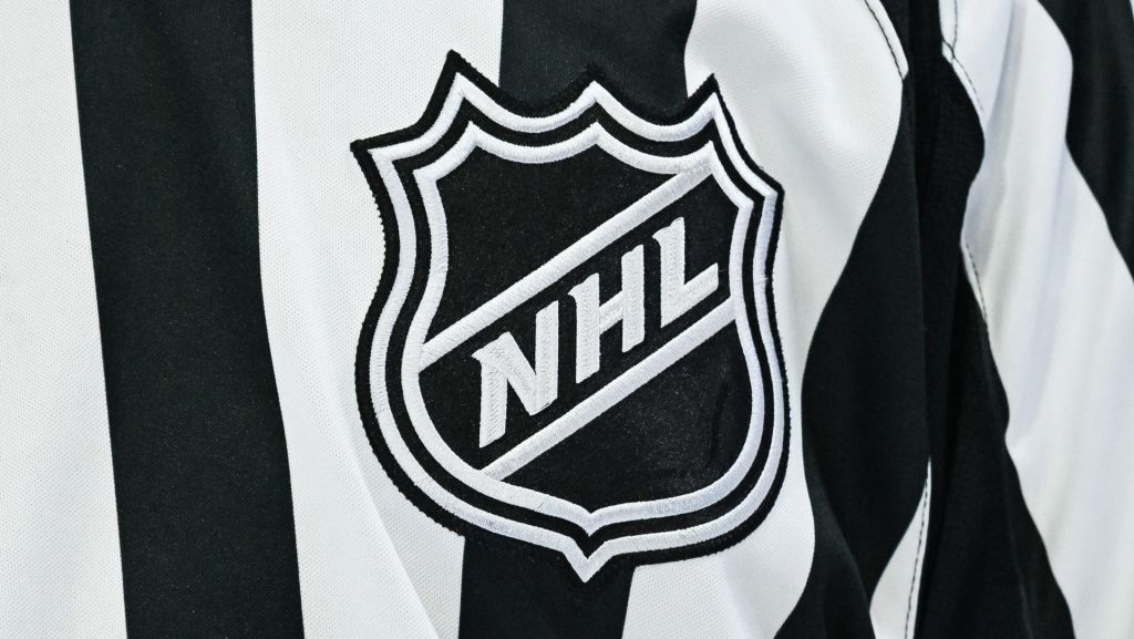 Mar 14, 2026; Montreal, Quebec, CAN; View of an NHL logo on a jersey worn by a linesman during the third period at Bell Centre.