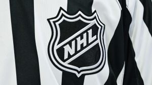 Mar 14, 2026; Montreal, Quebec, CAN; View of an NHL logo on a jersey worn by a linesman during the third period at Bell Centre.