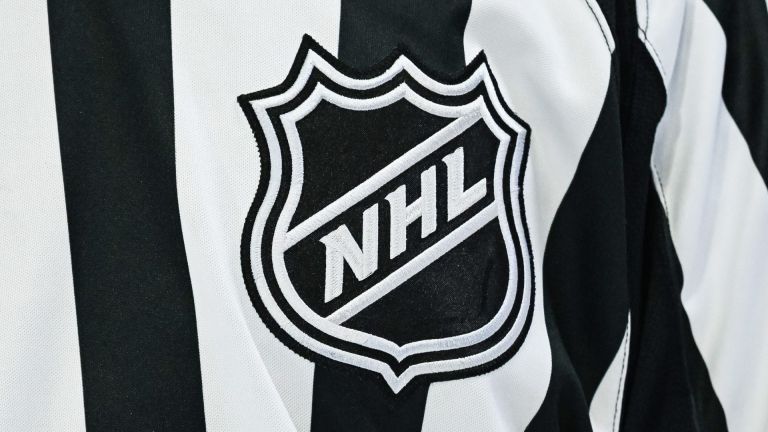 Mar 14, 2026; Montreal, Quebec, CAN; View of an NHL logo on a jersey worn by a linesman during the third period at Bell Centre.