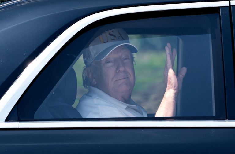 President Donald Trump waves as he leaves Trump International Golf Club on March 28, 2026, in West Palm Beach, Florida.