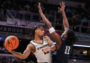 Emory Eagles guard Ben Pearce (10) passes around Mary Washington Eagles forward Jay Randall (11) on Sunday, April 5, 2026, during the NCAA DIII men's basketball championship game at Gainbridge Fieldhouse in Indianapolis.