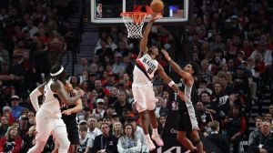 Apr 24, 2026; Portland, Oregon, USA; Portland Trail Blazers guard Scoot Henderson (00) shoots the ball over San Antonio Spurs guard Dylan Harper (2) during the second half during game three of the first round of the 2026 NBA Playoffs at Moda Center.