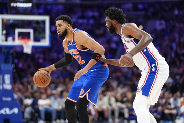 May 10, 2026; Philadelphia, Pennsylvania, USA; New York Knicks center Karl-Anthony Towns (32) controls the ball against Philadelphia 76ers center Joel Embiid (21) in the second quarter during game four of the second round of the 2026 NBA Playoffs at Xfinity Mobile Arena.