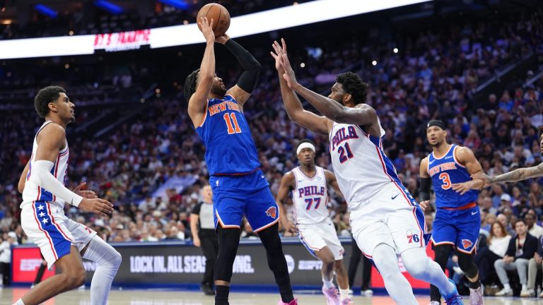 May 10, 2026; Philadelphia, Pennsylvania, USA; New York Knicks guard Jalen Brunson (11) shoots the ball against Philadelphia 76ers center Joel Embiid (21) in the second quarter during game four of the second round of the 2026 NBA Playoffs at Xfinity Mobile Arena.