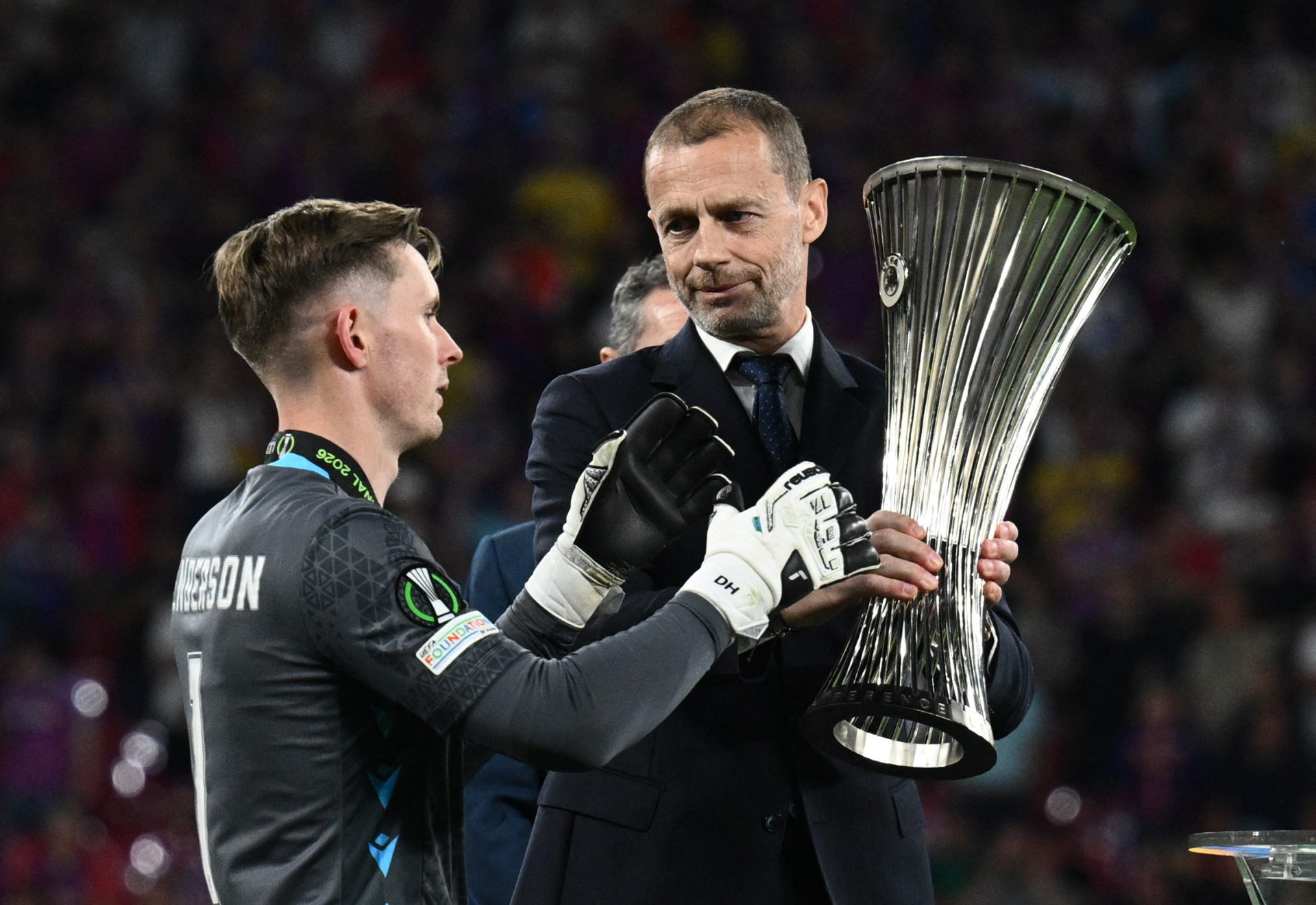 Soccer Football - UEFA Conference League - Final - Crystal Palace v Rayo Vallecano - Red Bull Arena, Leipzig, Germany - May 27, 2026 Crystal Palace's Dean Henderson collects the trophy from UEFA president Aleksander Ceferin after winning the UEFA Conference League