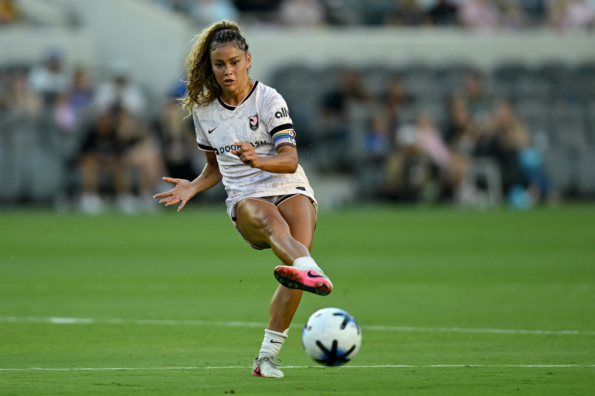 Jul 26, 2026; Los Angeles, California, USA; Angel City FC defender Sarah Gorden (11) passes the ball against the Racing Louisville FC during the first half at BMO Stadium.