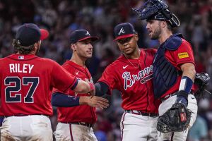Jul 31, 2026; Cumberland, Georgia, USA; Atlanta Braves third baseman Austin Riley (27) first baseman Matt Olson (28) pitcher Elieser Hernandez and catcher Joey Bart (16) react after defeating the Washington Nationals at Truist Park.