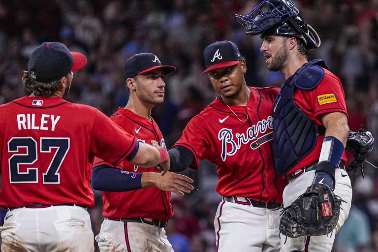 Jul 31, 2026; Cumberland, Georgia, USA; Atlanta Braves third baseman Austin Riley (27) first baseman Matt Olson (28) pitcher Elieser Hernandez and catcher Joey Bart (16) react after defeating the Washington Nationals at Truist Park.