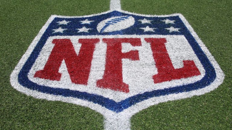 Aug 6, 2026; Canton, Ohio, USA; The NFL shield logo on the field before the Carolina Panthers and Arizona Cardinals play at Tom Benson Hall of Fame Stadium. Mandatory Credit: