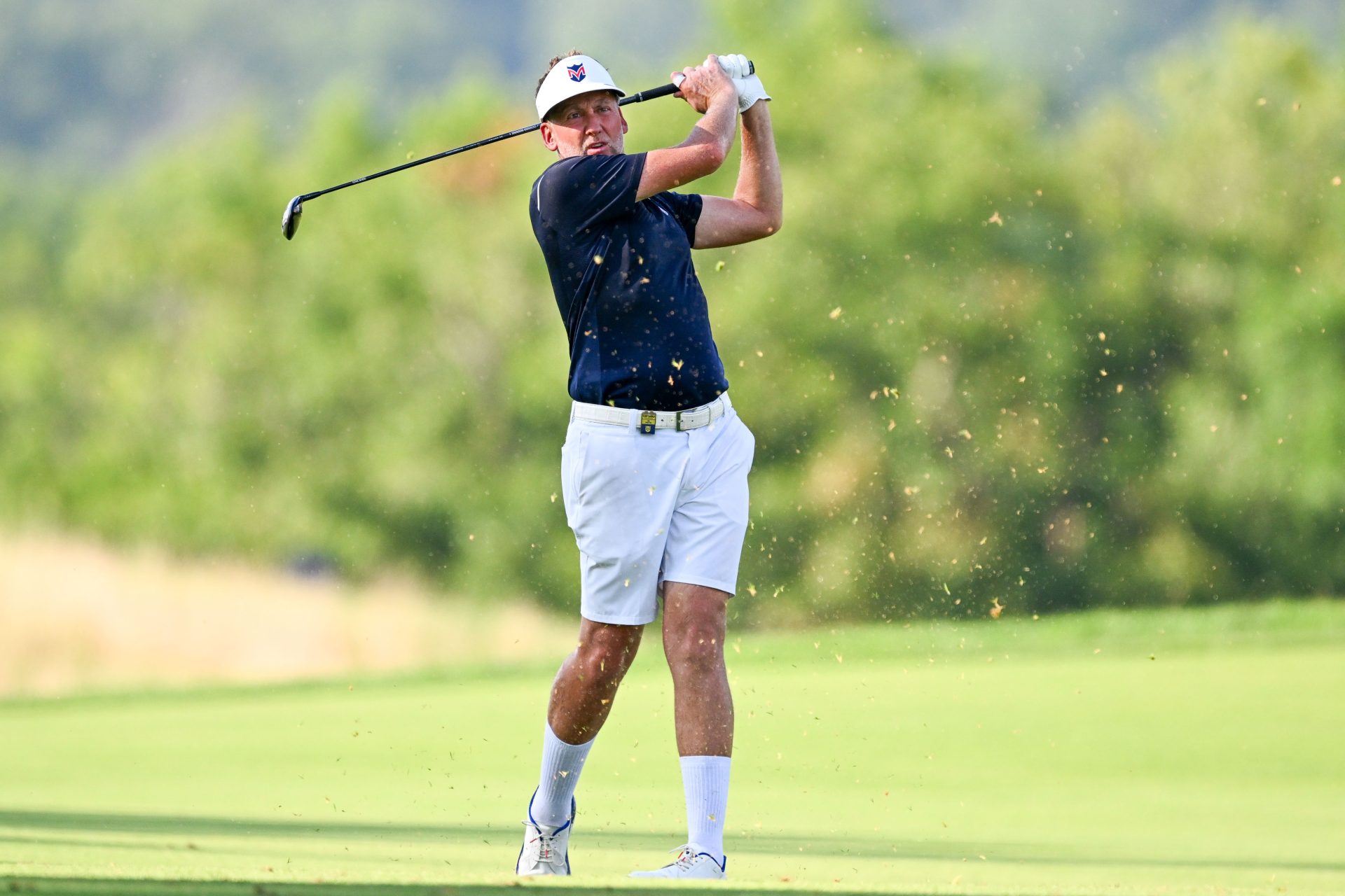 Aug 6, 2026; Bedminster, New Jersey, USA; Ian Poulter hits out of the fairway on the ninth hole during the first round of the LIV Golf New York tournament at Trump National Bedminster.