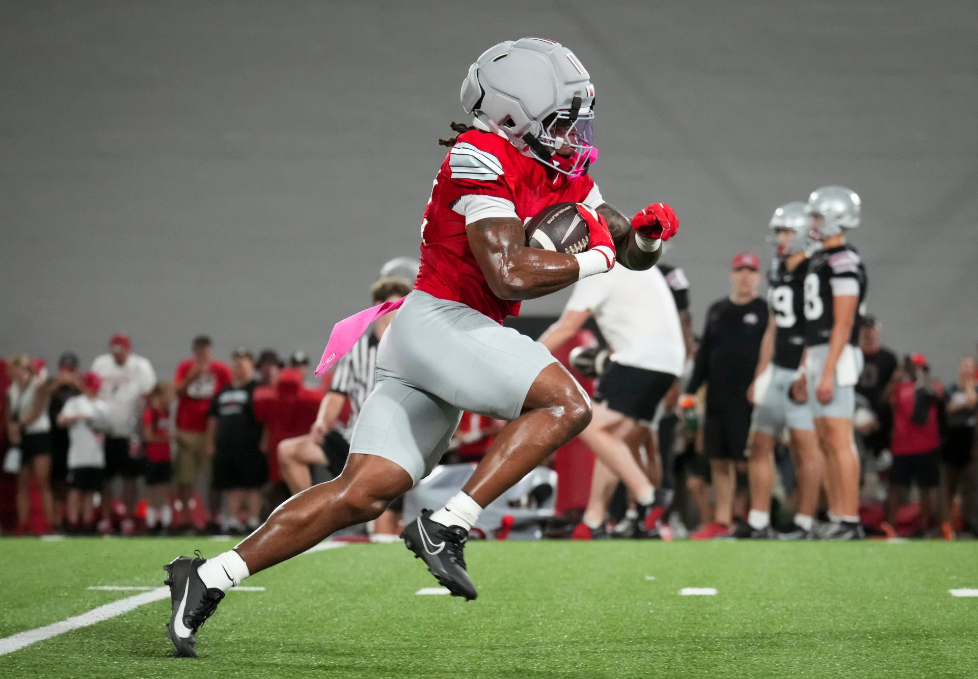 Ohio State Buckeyes running back Isaiah West (32) runs during football training camp inside the Woody Hayes Athletic Center in Columbus on Aug. 7, 2026.