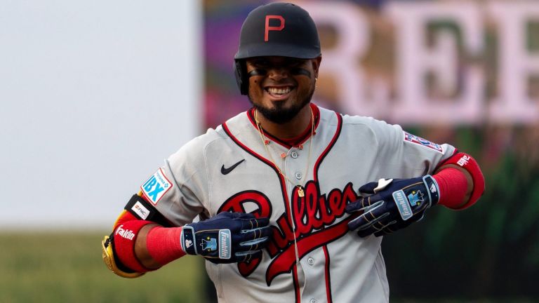 Philadelphia Phillies second baseman Luis Arraez (4) celebrates after getting on base Aug. 13, 2026 at the Field of Dreams in Dyersville, Iowa.