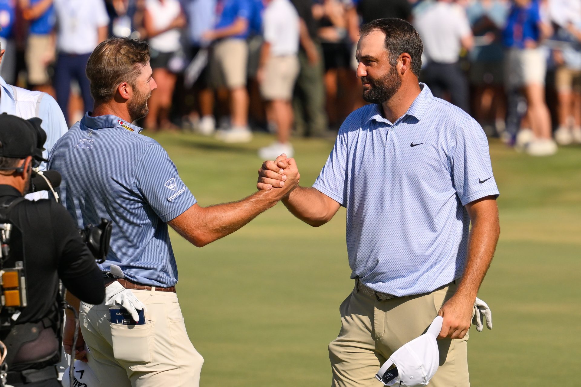 Aug 16, 2026; Memphis, Tennessee, USA; Sam Burns congratulates Scottie Scheffler on the tournament win during the final round of the FedEx St. Jude Championship golf tournament.