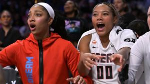 Aug 20, 2026; Los Angeles, California, USA; Atlanta Dream forward Angel Reese (5) and forward Naz Hillmon (00) cheer from the bench in the fourth quarter of the game against the Los Angeles Sparks in the second half at Crypto.com Arena