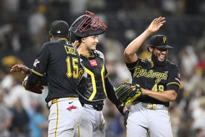 Aug 24, 2026; San Diego, California, USA; Pittsburgh Pirates center fielder Oneil Cruz (15), catcher Rafael Flores Jr. (43) and pitcher Yohan Ramirez (49) celebrate after the Pirates beat the San Diego Padres at Petco Park.