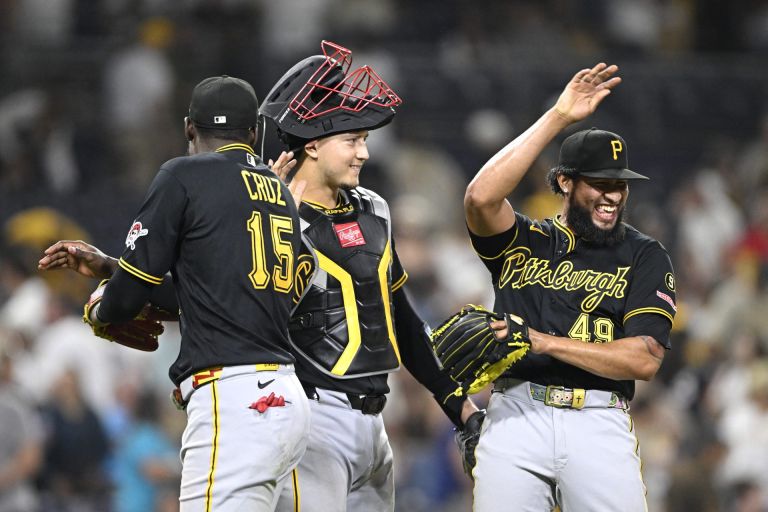 Aug 24, 2026; San Diego, California, USA; Pittsburgh Pirates center fielder Oneil Cruz (15), catcher Rafael Flores Jr. (43) and pitcher Yohan Ramirez (49) celebrate after the Pirates beat the San Diego Padres at Petco Park.