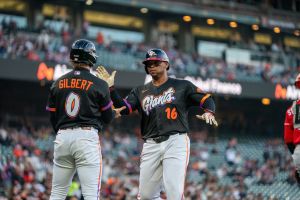 Aug 25, 2026; San Francisco, California, USA; San Francisco Giants first baseman Rafael Devers (16) and San Francisco Giants center fielder Drew Gilbert (0) celebrate after scoring against the Cincinnati Reds during the first inning at Oracle Park.