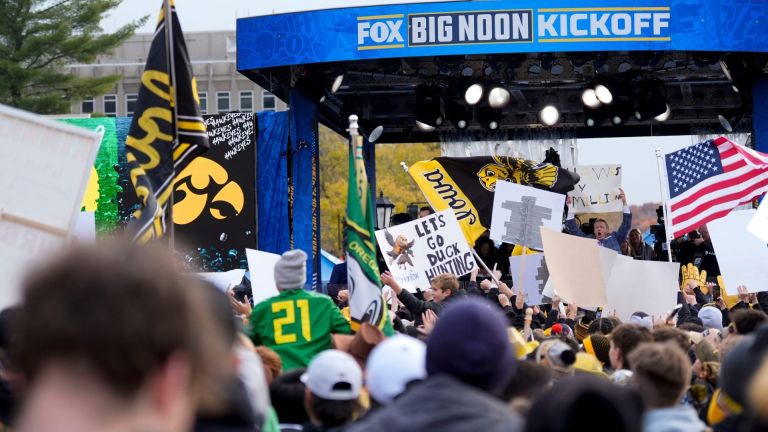 Hawkeye and Oregon fans gather for FOXs Big Noon Kickoff Nov. 8, 2025 in front of the Old Capitol Building on the University of Iowa Campus in Iowa City, Iowa.