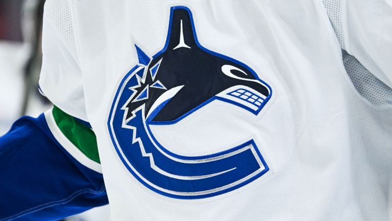 Jan 12, 2026; Montreal, Quebec, CAN; View of a Vancouver Canucks logo on a jersey worn by a member of the team during the second period at Bell Centre. Mandatory Credit: David Kirouac-Imagn Images