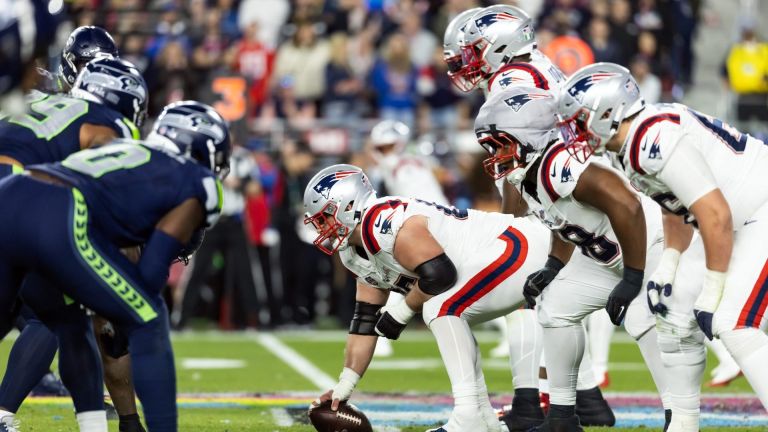 Feb 8, 2026; Santa Clara, CA, USA;General view down the line of scrimmage as New England Patriots center Garrett Bradbury (65) prepares to snap the ball against the Seattle Seahawks during Super Bowl LX at Levi's Stadium. Mandatory Credit: Mark J. Rebilas-Imagn Images