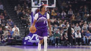 Apr 1, 2026; Salt Lake City, Utah, USA; Utah Jazz forward Cody Williams (5) brings the ball up the court against the Denver Nuggets during the first quarter at Delta Center.