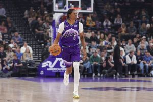 Apr 1, 2026; Salt Lake City, Utah, USA; Utah Jazz forward Cody Williams (5) brings the ball up the court against the Denver Nuggets during the first quarter at Delta Center.