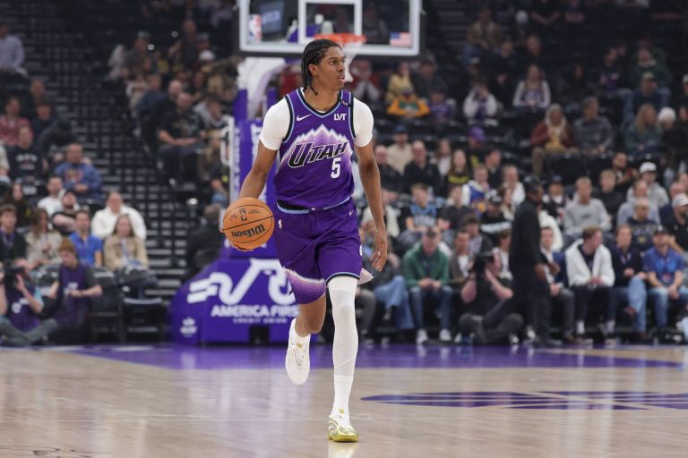 Apr 1, 2026; Salt Lake City, Utah, USA; Utah Jazz forward Cody Williams (5) brings the ball up the court against the Denver Nuggets during the first quarter at Delta Center.