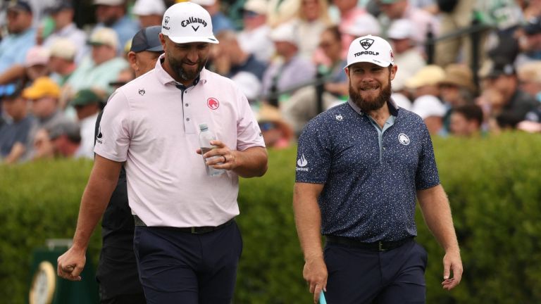 Golf - The Masters - Augusta National Golf Club, Augusta, Georgia, U.S. - April 6, 2026 England's Tyrrell Hatton and Spain's Jon Rahm on the practice range during a practice round REUTERS/Mike Segar