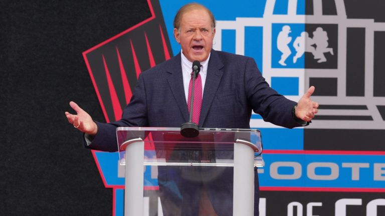 Aug 8, 2026; Canton, OH, USA; Chris Berman moderates the Pro Football Hall of Fame enshrinement at Tom Benson Hall of Fame Stadium. Mandatory Credit: Kirby Lee-Imagn Images