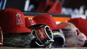 Aug 8, 2026; Miami, Florida, USA; Los Angeles Angels hats and gloves sit in the dugout against the Miami Marlins during the fifth inning at loanDepot Park. Mandatory Credit: Rhona Wise-Imagn Images