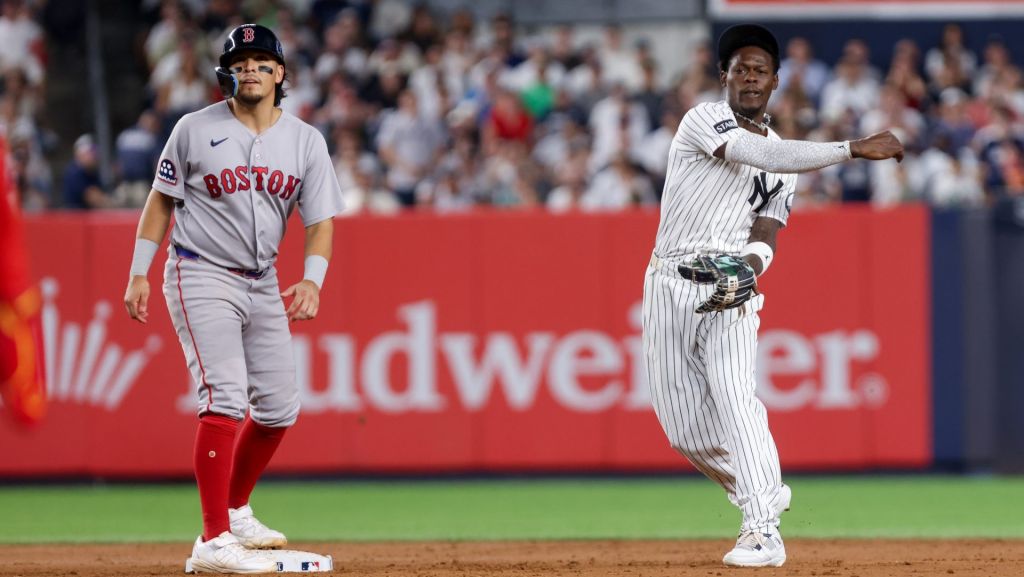 Aug 28, 2026; Bronx, New York, USA; New York Yankees second baseman Jazz Chisholm Jr. (13) throws to first for a double play against the Boston Red Sox during the fifth inning at Yankee Stadium. Mandatory Credit: Tom Horak-Imagn Images