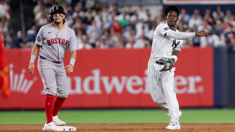 Aug 28, 2026; Bronx, New York, USA; New York Yankees second baseman Jazz Chisholm Jr. (13) throws to first for a double play against the Boston Red Sox during the fifth inning at Yankee Stadium. Mandatory Credit: Tom Horak-Imagn Images