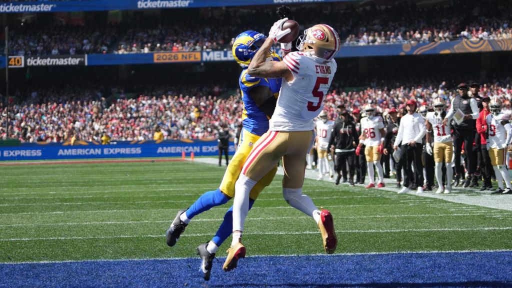 Sep 11, 2026; Melbourne, AUS; San Francisco 49ers wide receiver Mike Evans (5) makes a touchdown catch over Los Angeles Rams cornerback Jaylen Watson (35) in the second half at Melbourne Cricket Ground. Mandatory Credit: Kirby Lee-Imagn Images