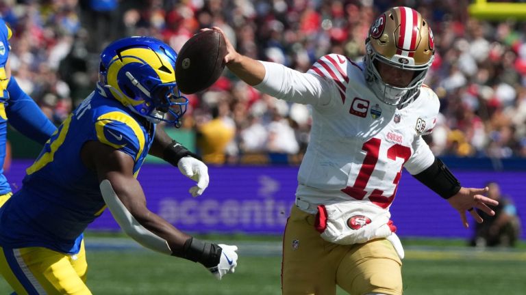Sep 11, 2026; Melbourne, AUS; San Francisco 49ers quarterback Brock Purdy (13) rushes the ball in the second half against the Los Angeles Rams at Melbourne Cricket Ground. Mandatory Credit: Kirby Lee-Imagn Images