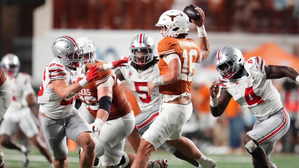 Texas Longhorns quarterback Arch Manning (16) looks to throw over Ohio State Buckeyes linebacker Payton Pierce (26) during the NCAA football game at Darrell K RoyalTexas Memorial Stadium in Austin, Texas on Sept. 12, 2026. Texas won 24-23.