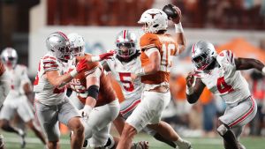 Texas Longhorns quarterback Arch Manning (16) looks to throw over Ohio State Buckeyes linebacker Payton Pierce (26) during the NCAA football game at Darrell K RoyalTexas Memorial Stadium in Austin, Texas on Sept. 12, 2026. Texas won 24-23.